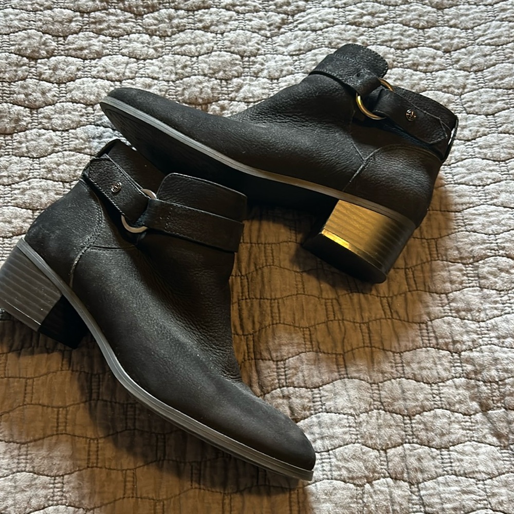 Black shorty boots with buckke accent
